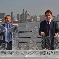 Colin Jones (Inteb's managing director) and Tom Kelly (consulting services manager) with the £1.7bn ice sculpture in front of the Royal Liver Building - on which they carry out the energy reporting for RLAM